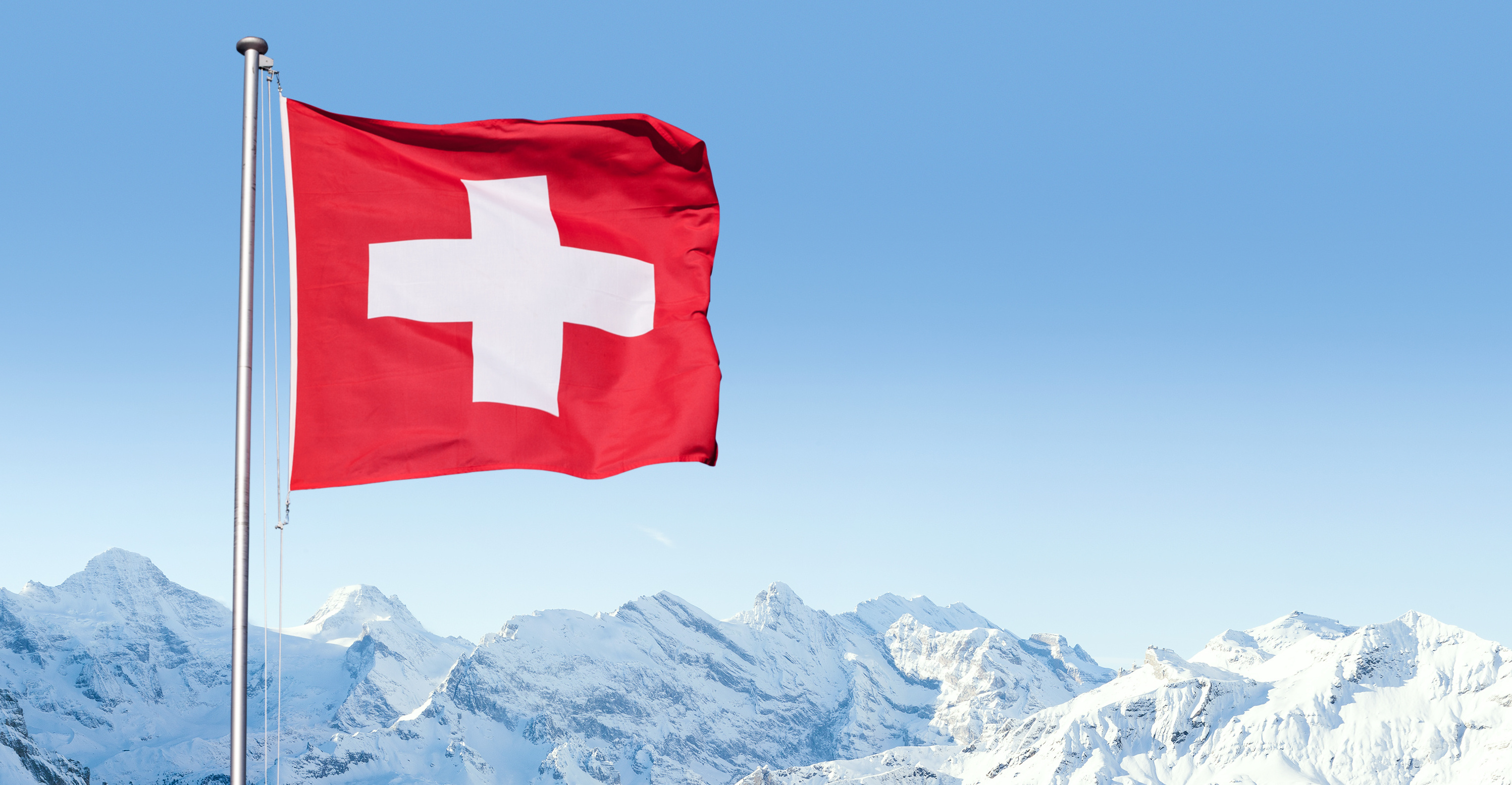 Swiss flag with snowy mountain landscape