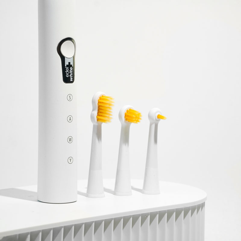 edel white sonic toothbrush with Swiss Dental Expert brush heads