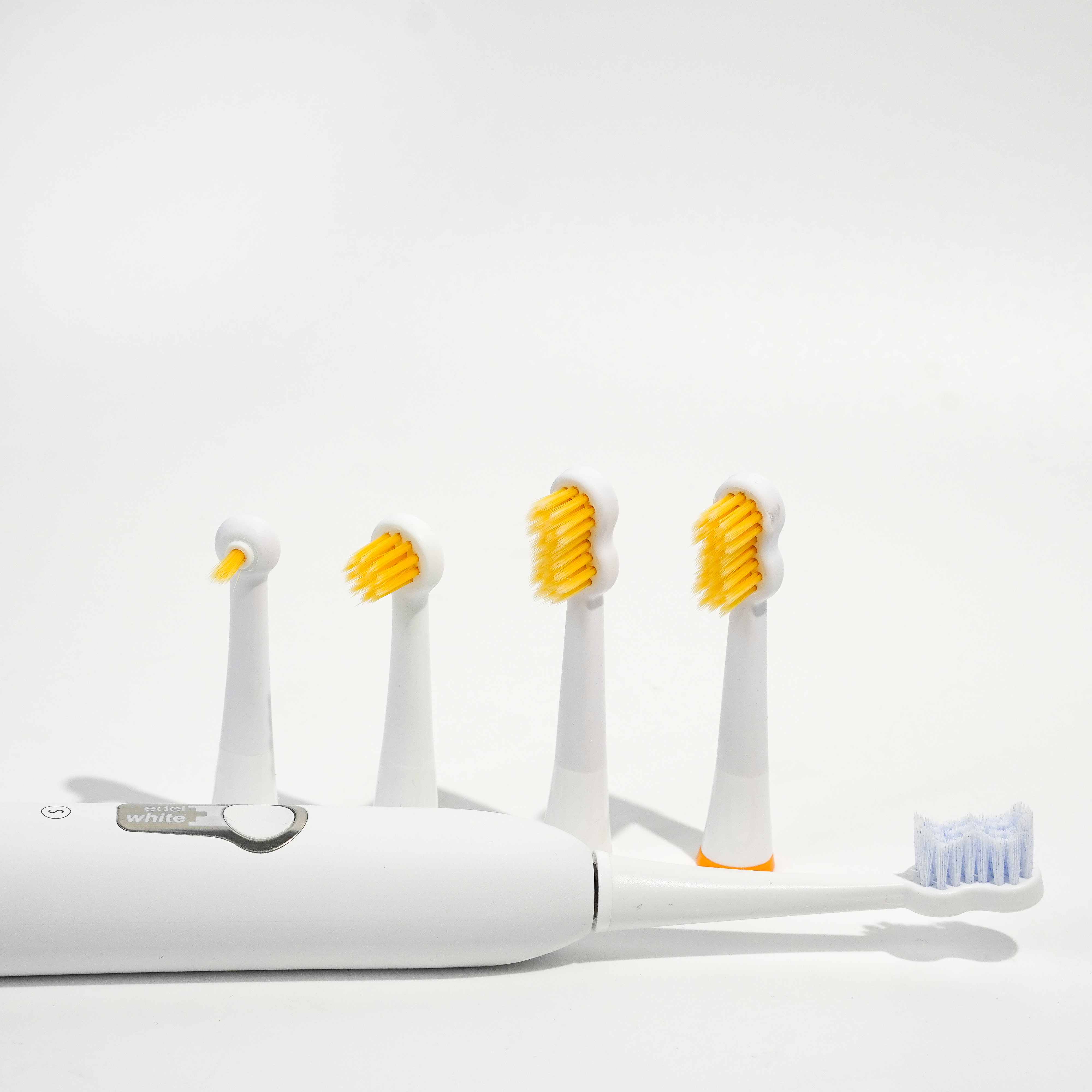 edel white sonic toothbrush with Swiss Dental Expert brush heads