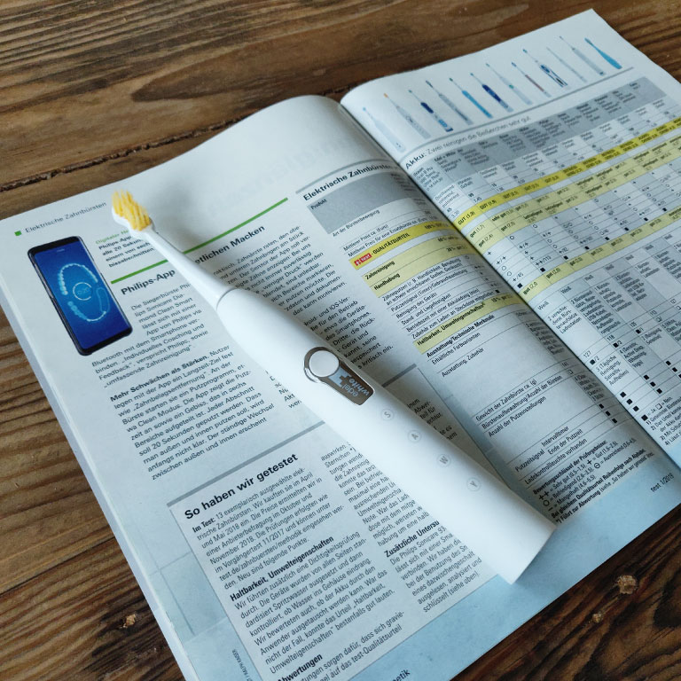 edel white sonic toothbrush with Stiftung Warentest magazine